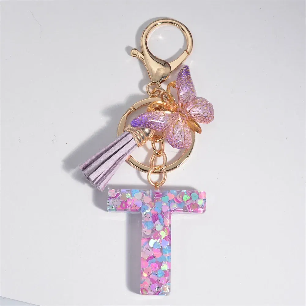 Color: Light Pink - Fashion Tassel Butterfly 26Letter Keychain Colorful Love Heart Filled Resin Alphabet Keyring Women Girls Car Bag Phone Pendant