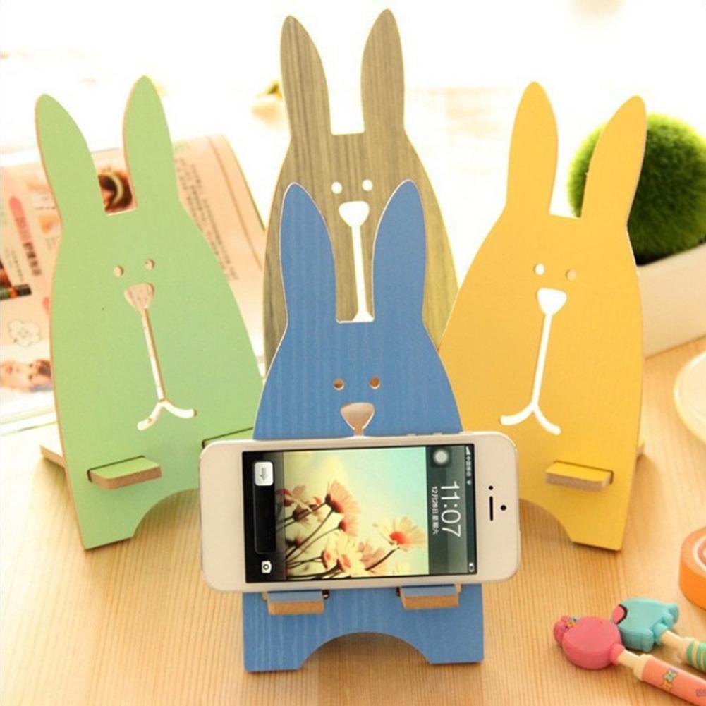Color: black - Portable Wood Mobile Phone Cellphone Holder Desktop Mount Stand Bracket Rack Mobile Phone Accessories 2021