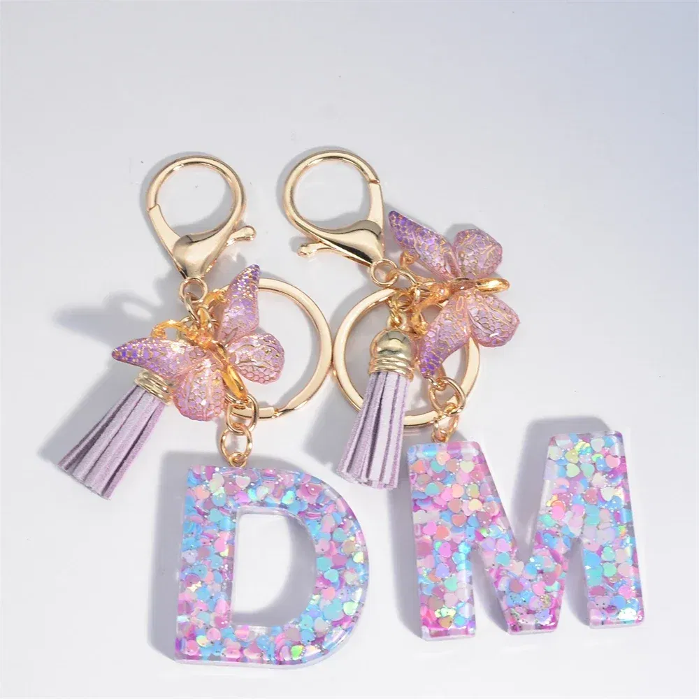 Color: Yellow - Fashion Tassel Butterfly 26Letter Keychain Colorful Love Heart Filled Resin Alphabet Keyring Women Girls Car Bag Phone Pendant