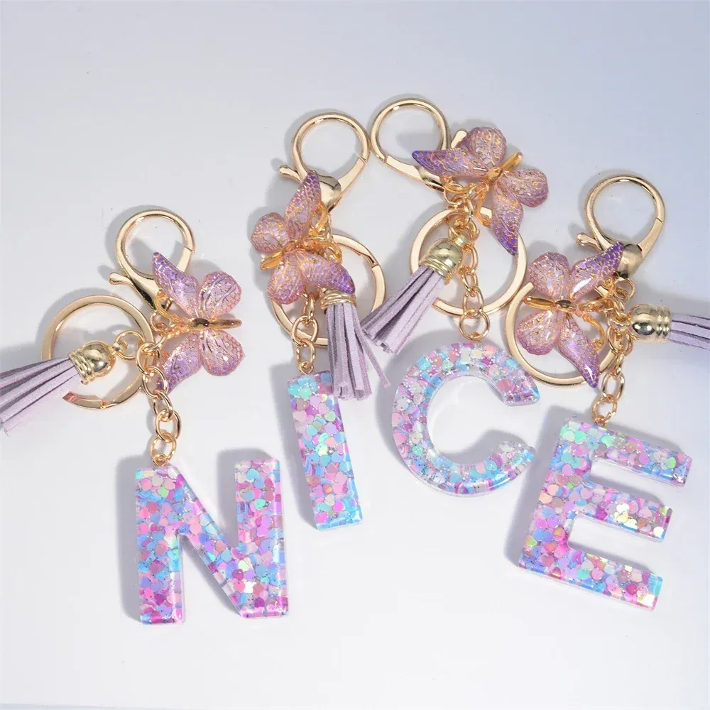 Color: Yellow - Fashion Tassel Butterfly 26Letter Keychain Colorful Love Heart Filled Resin Alphabet Keyring Women Girls Car Bag Phone Pendant
