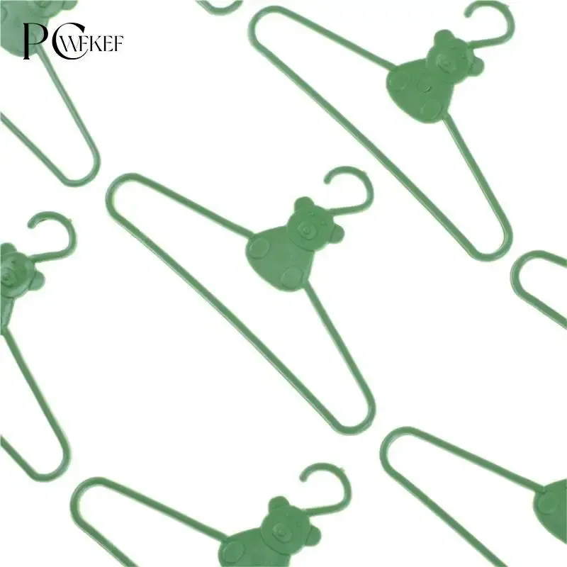 Color: Yellow - 10/20 PCS / Lot Lovely Green Hangers Mini Cute Wardrobe Dress Coat Clothes Plastic Accessories For Babi Doll Dollhouse Gift Toy