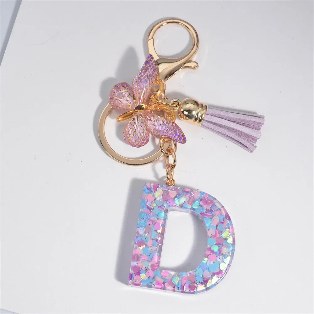 Color: Red - Fashion Tassel Butterfly 26Letter Keychain Colorful Love Heart Filled Resin Alphabet Keyring Women Girls Car Bag Phone Pendant