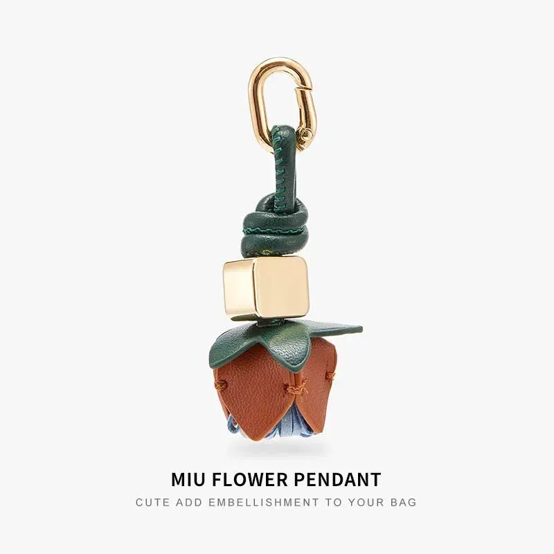 Color: Brown - Cowhide bag charm exquisite tomato string pendant woman all-match cute backpack pendant bag accessories