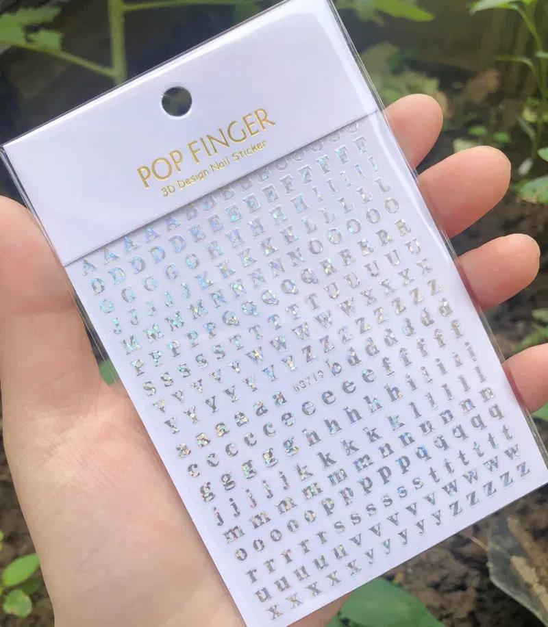 Color: black - 1PCS New English Alphabet Nail Stickers Multi-Color Laser Reflective Nail Slider Art Cool Text Nail Kit