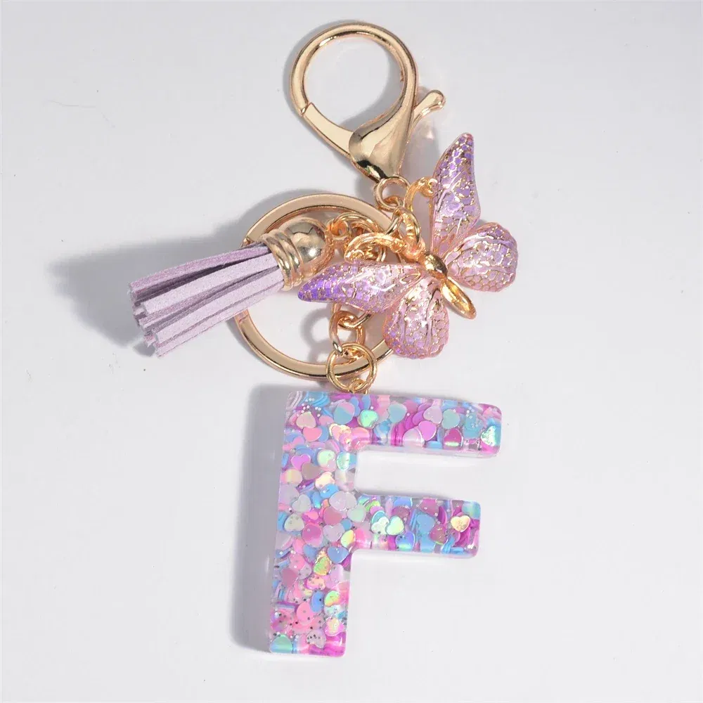 Color: Blue - Fashion Tassel Butterfly 26Letter Keychain Colorful Love Heart Filled Resin Alphabet Keyring Women Girls Car Bag Phone Pendant
