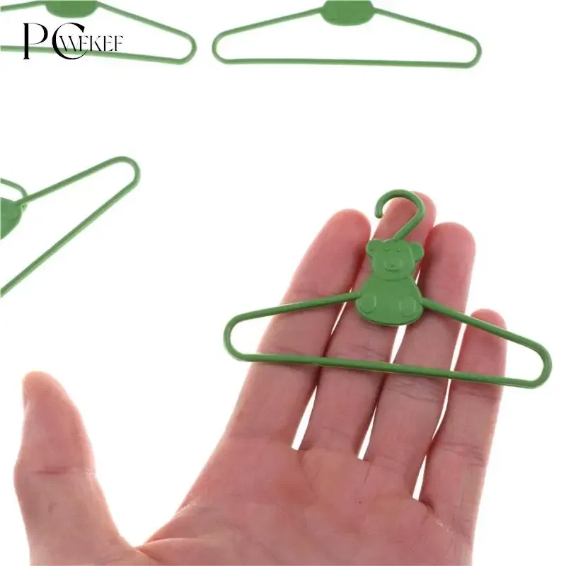 Color: Blue - 10/20 PCS / Lot Lovely Green Hangers Mini Cute Wardrobe Dress Coat Clothes Plastic Accessories For Babi Doll Dollhouse Gift Toy