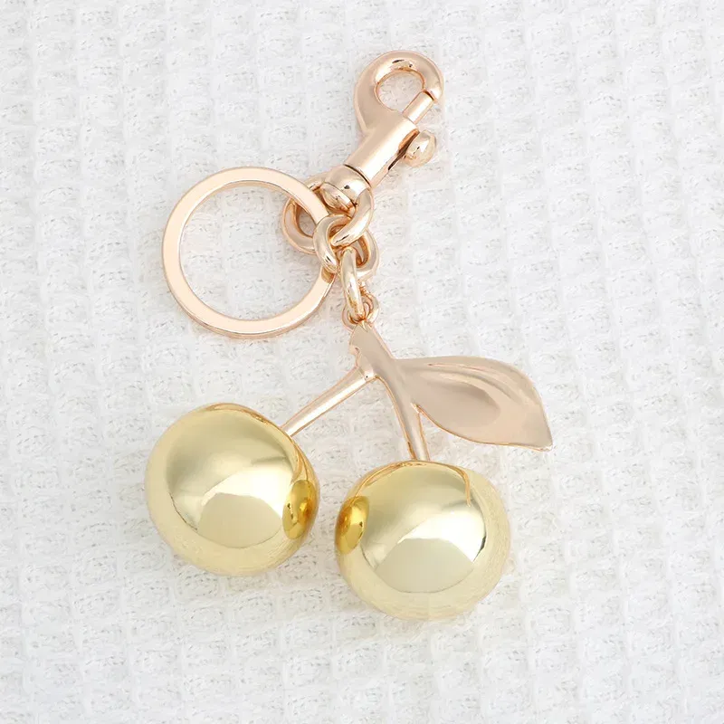Color: Bronze - Fashion Glitter Gold Cherry Keychain Summer Fruits Cherries Pendant Keyring For Women Men Jewelry Bag Accessories Gift