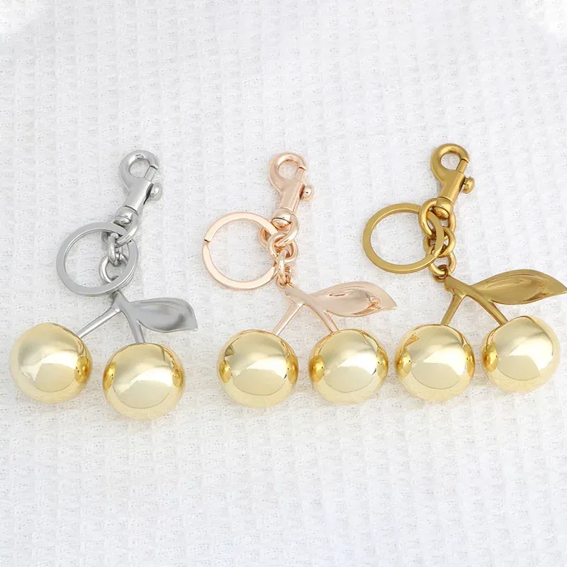 Color: Bronze - Fashion Glitter Gold Cherry Keychain Summer Fruits Cherries Pendant Keyring For Women Men Jewelry Bag Accessories Gift