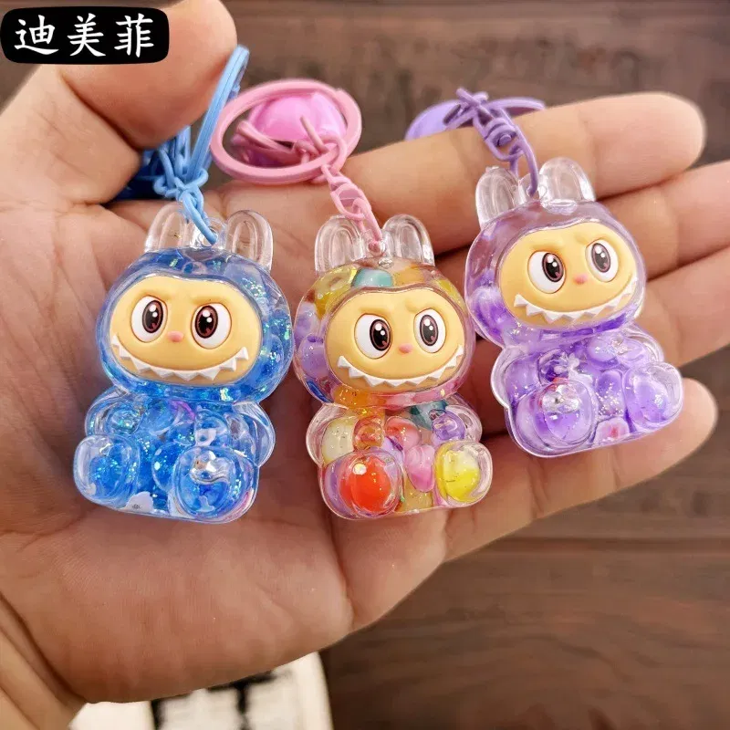 Color: Yellow, Ships From: CHINA - Creative keychain oil series doll quicksand bottle small pendant gift decoration