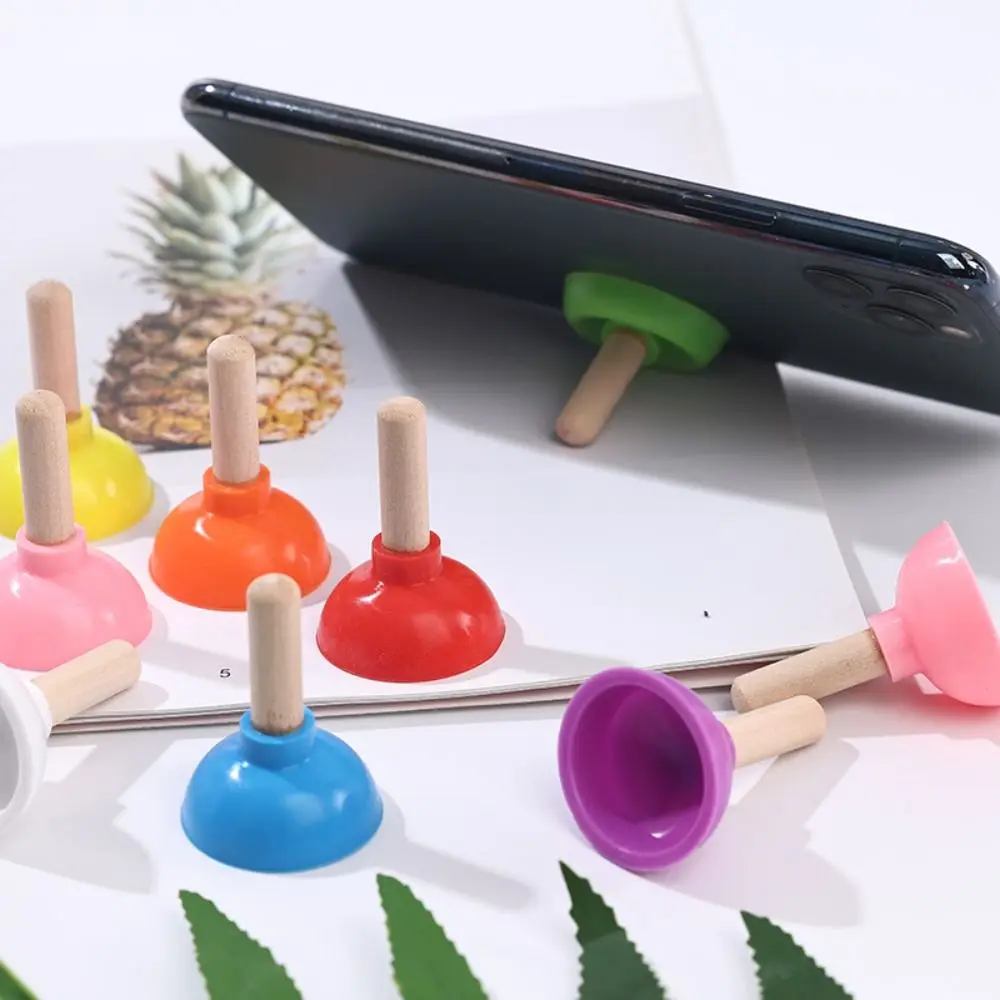 Color: Sapphire - Mini Colorful Toilet Shape Plunger Phone Holder Sucker Stand Tiny Plunger Magic Tricks Inspired Looking For Card Professional