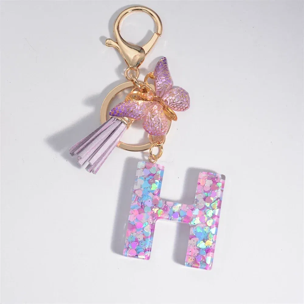 Color: Pink - Fashion Tassel Butterfly 26Letter Keychain Colorful Love Heart Filled Resin Alphabet Keyring Women Girls Car Bag Phone Pendant