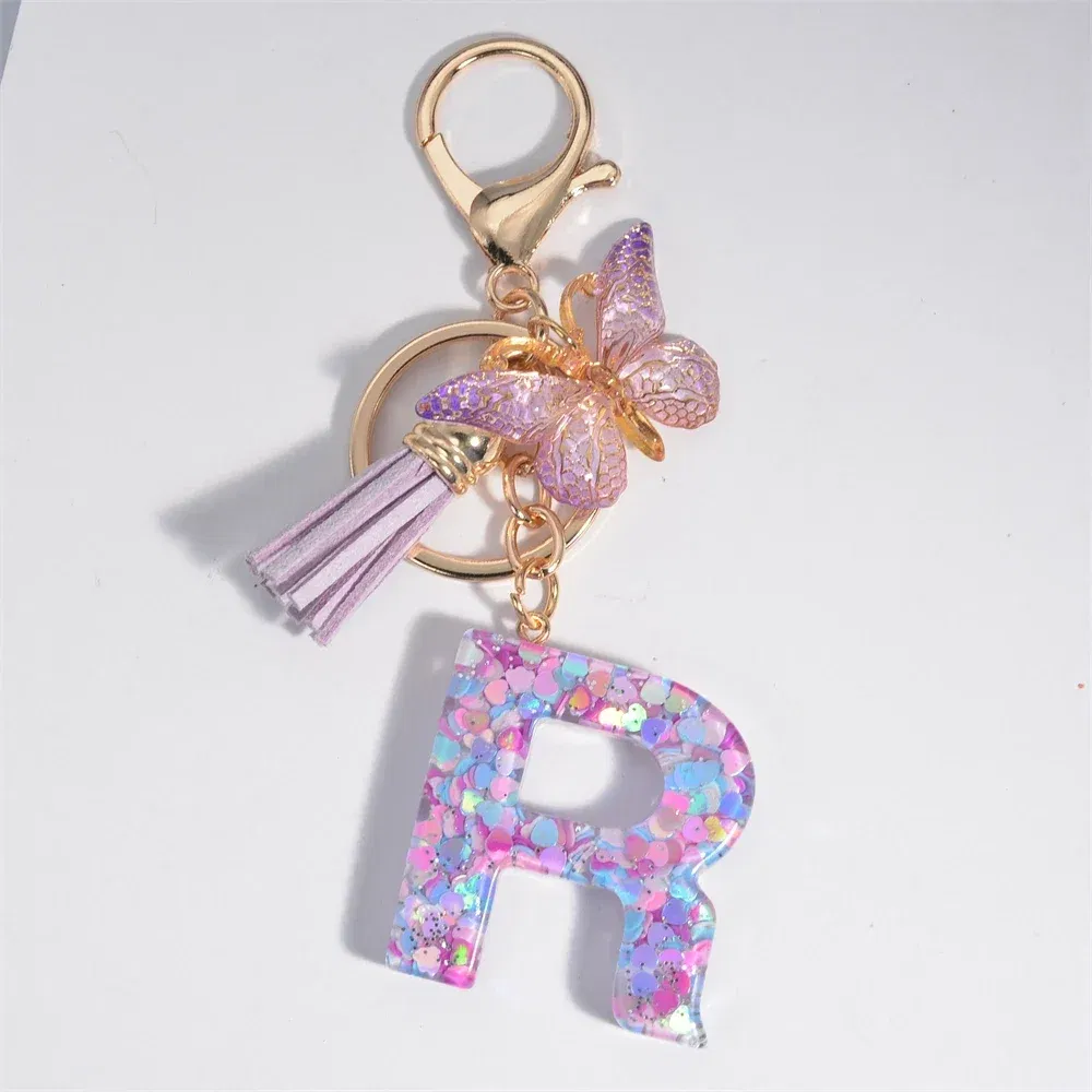 Color: SKY BLUE - Fashion Tassel Butterfly 26Letter Keychain Colorful Love Heart Filled Resin Alphabet Keyring Women Girls Car Bag Phone Pendant
