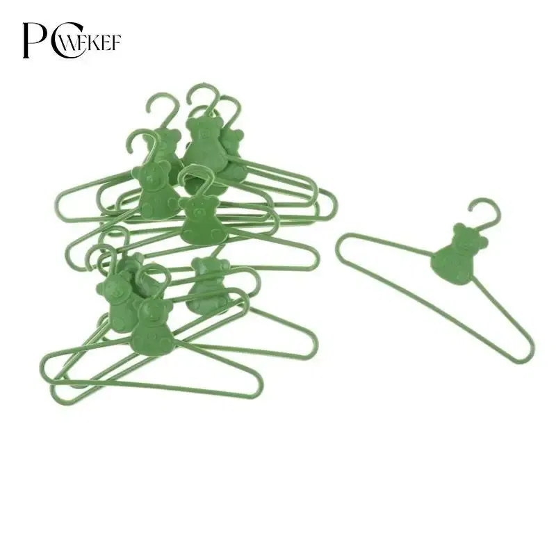 Color: PURPLE - 10/20 PCS / Lot Lovely Green Hangers Mini Cute Wardrobe Dress Coat Clothes Plastic Accessories For Babi Doll Dollhouse Gift Toy