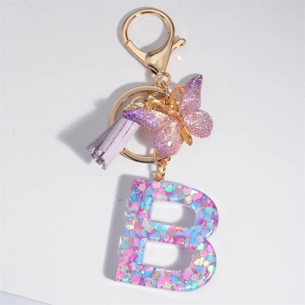 Color: black - Fashion Tassel Butterfly 26Letter Keychain Colorful Love Heart Filled Resin Alphabet Keyring Women Girls Car Bag Phone Pendant