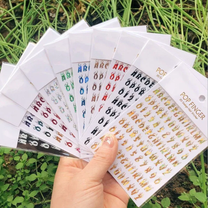 Color: Sky Blue - 1PCS New English Alphabet Nail Stickers Multi-Color Laser Reflective Nail Slider Art Cool Text Nail Kit